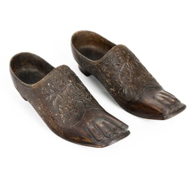A whimsical pair of Continental carved wood heeled shoes or clogs