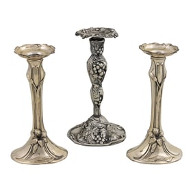 A pair of American Art Nouveau sterling weighted candlesticks