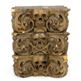 A set of three Victorian carved architectural capitals incorporating skulls and crossbones