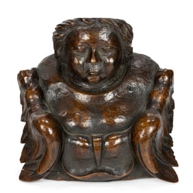A Continental carved architectural fragment of an angel