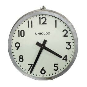 A Uniclox Industrial electric wall clock with aluminum case