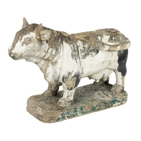 A European carved wood figure of a Holstein cow with traces of polychrome