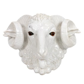 A large Continental majolica ram's head with glass inset eyes