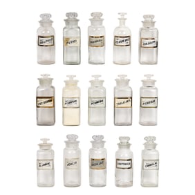A collection of fifteen glass apothecary bottles