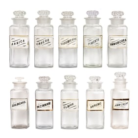 A group of ten glass apothecary bottles