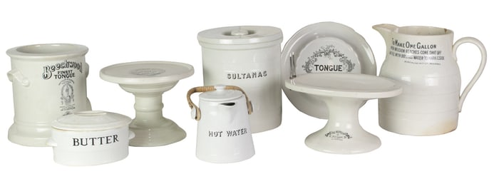 A group of English ironstone advertising display stands and containers