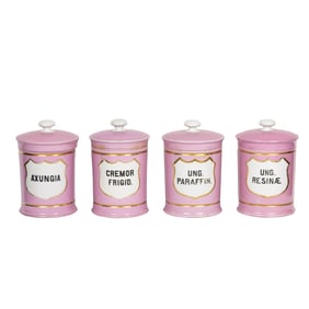 A set of four German porcelain pink and white apothecary jars