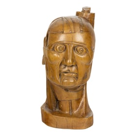 A carved ecorche study of a man’s head