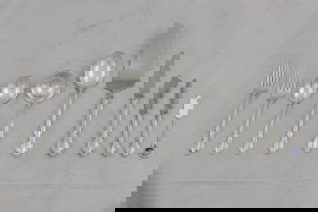 A Towle Legato sterling silver flatware service: A Towle Legato sterling silver flatware service: (12) dinner forks 7.5"l; (12) dinner knives with stainless blades 9"l; (12) salad forks 6.5"l; (25) teaspoons; (12) large soup spoons 6.5"l; a master