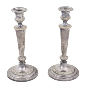 A pair of English silver plated candlesticks