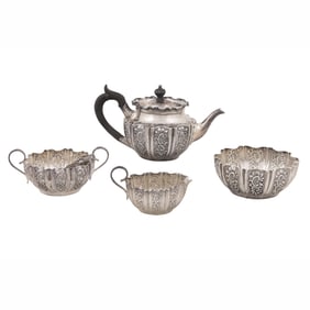 An English Sheffield sterling repousse four-piece tea service