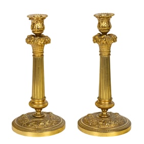 A pair of Neoclassical style gilt bronze candlesticks