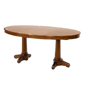 A custom made Danish Modern style quilted narra mahogany double pedestal dining table