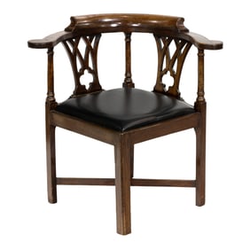 A George III mahogany corner armchair