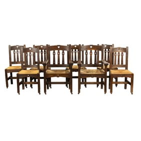 A set of eight Arts and Crafts dining chairs