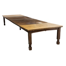 An Arts and Crafts oak dining table circa 1910
