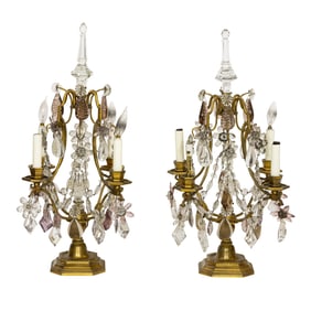 A pair of Louis XVI style gilt bronze four light girandole candelabra