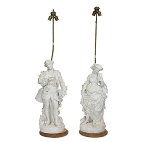 A pair of Sevres style bisque porcelain figures now mounted as table lamps