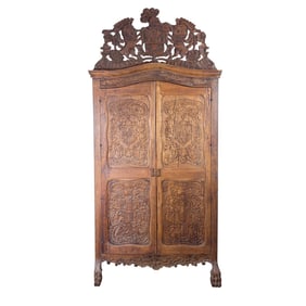 A Continental Rococo style carved armoire, 18th century