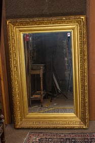 A large European giltwood and gesso rectangular mirror
