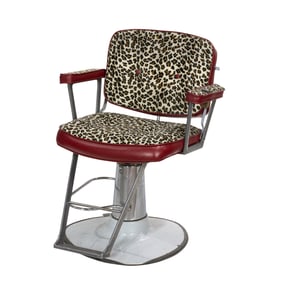 A Modern adjustable barber chair with leopard upholstered seat