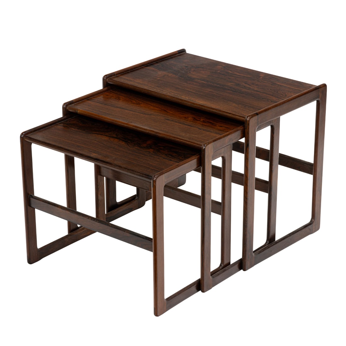 A suite of Mid-Century rosewood nesting tables: A suite of Mid-Century rosewood nesting tables, each with a highly figured top, 18"h x 25"w x 15"d