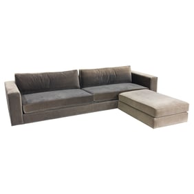 A Restoration Hardware sofa covered in grey textured fabric