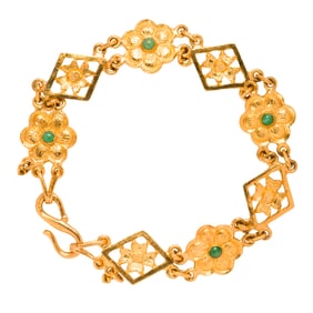 Two high karat gold and jade bracelets