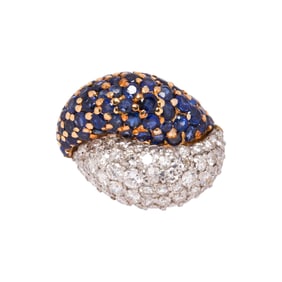 A sapphire, diamond, 18k gold and platinum ring