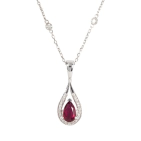 A ruby, diamond and 14k white gold pendant necklace