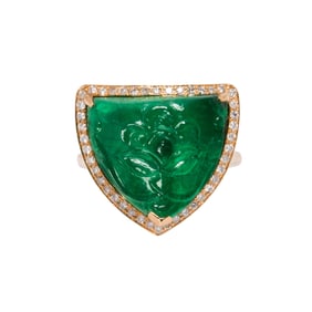 An emerald, diamond, and 18k gold ring