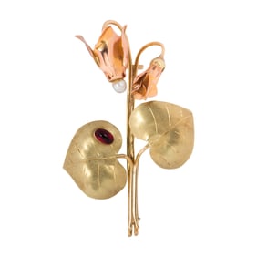 A vintage 14k bi-color gold and gem-set brooch, Vienna