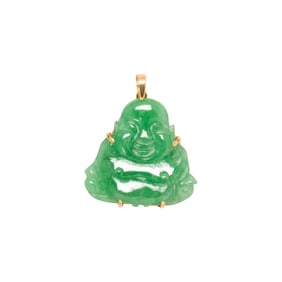A jade and 14k gold pendant