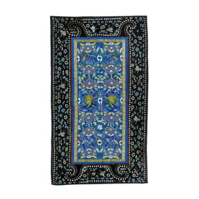 A Chinese embroidered blue ground peacock panel