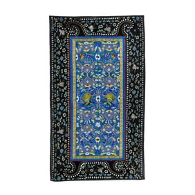 A Chinese embroidered blue ground peacock panel