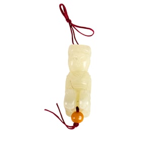 A Chinese white jade kneeling figure