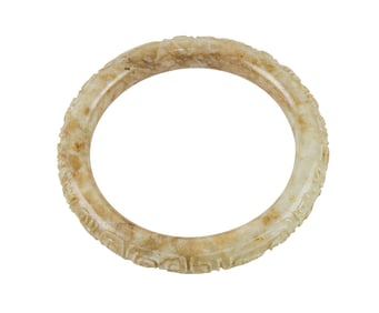 A Chinese chicken-bone jade bangle bracelet