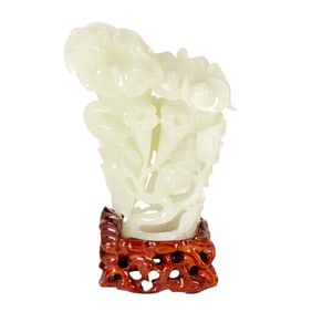 A Chinese white jade magnolia vase