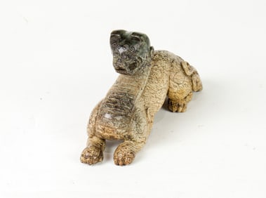 A Han style hardstone mythical beast pendant