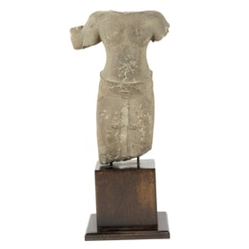 A Khmer sandstone torso of a male deity with stand