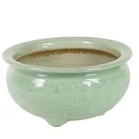 A Chinese celadon glazed tripod incense burner
