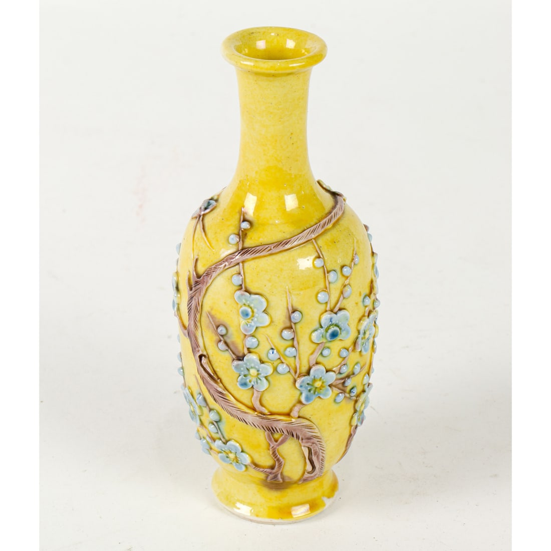A Chinese yellow glazed biscuit porcelain vase: A Chinese yellow glazed biscuit porcelain vase. Featuring prunus blossom, Republic period, 5.25" high.