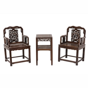 A set of Chinese hongmu armchairs and side table