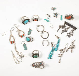 A group of Native American hardstone and silver jewelry: A group of Native American hardstone and silver jewelrycomprising nine rings, ten pairs of earrings and a brooch, set with turquoise and coral; 76.00 gross grams