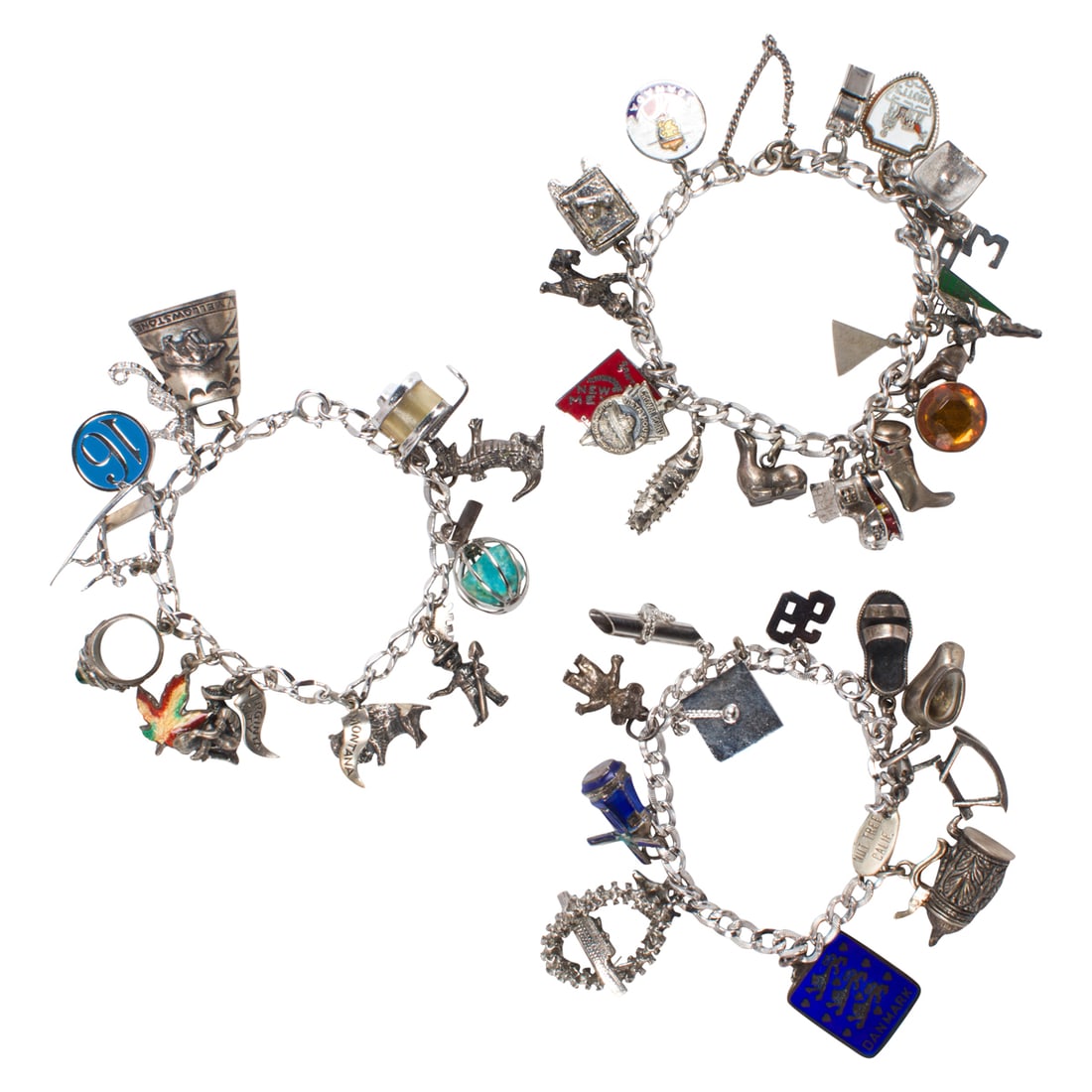 Set of sterling silver charm bracelets: Set of sterling silver charm braceletsOf eclectic design, featuring whistle, alligator, rocking horse etc. charms; gross weight: 145.18 grams