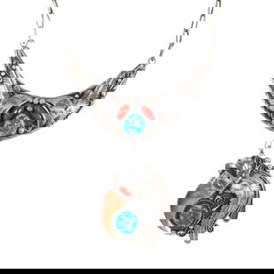 A Native American coral, turquoise and silver necklace: A Native American coral, turquoise and silver necklaceof botanical design, featuring oval coral cabochons and turquoise pieces, suspending from cable-link chain; marked with arrow head makers mark;