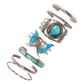 A group of Native American hardstone and silver bangle bracelets
