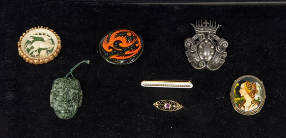 A group of brooches