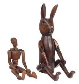 Two articulated wood figures of a mannequin and rabbit