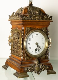 A diminutive Renaissance Revival brass mounted clock